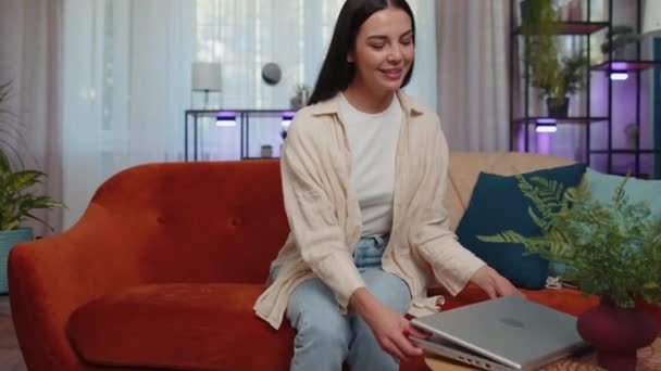 Lovely Adult Girl Freelancer Enters Home Living Room Sits Orange — Stockvideo