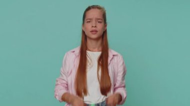Exhausted tired teenager young girl in pink shirt takes off glasses, feels eyes pain, being overwork burnout from long hours working. Student child kid isolated on blue studio background indoors
