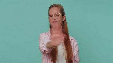 Dont want to hear and listen. Frustrated annoyed irritated pretty teenager girl covering ears, gesturing no, avoiding advice ignoring unpleasant noise loud voices. Young child kid on blue background