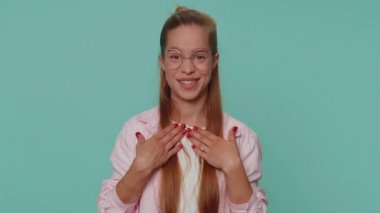 I am dont want it, not me. Confused upset teenager girl pointing fingers herself ask say who why me no thanks i do not need it, rejection, refusal, stop sign. Young teen child kid on blue background