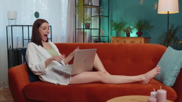 Overjoyed Caucasian Girl Home Lying Couch Laptop Scream Delight Raise — Stockvideo
