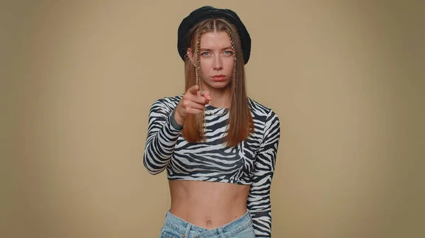 Hey you. Lovely pretty young woman smiling excitedly and pointing to camera, choosing lucky winner, indicating to awesome you. Adult stylish girl isolated alone on beige studio background indoors