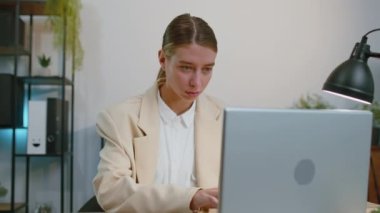 Businesswoman closing laptop pc computer after finishing work at home office desk. Smiling female manager freelancer girl busy working online, remote job. E-learning, browsing internet on notebook