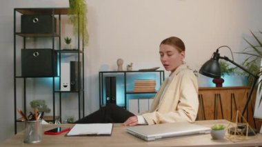 Businesswoman in suit working, having mobile phone talk at office workplace desk with laptop. Professional manager freelance woman holding smartphone using messenger chat apps. Employment, occupation