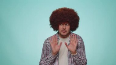 I am not guilty. Handsome bearded man with lush hair coiffure pointing fingers himself ask say who me no thanks i do not need it. Young adult guy boy isolated alone on blue studio wall background