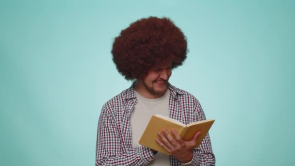 Happy Smiling Bearded Man Reading Funny Interesting Fairytale Story Book — Vídeos de Stock