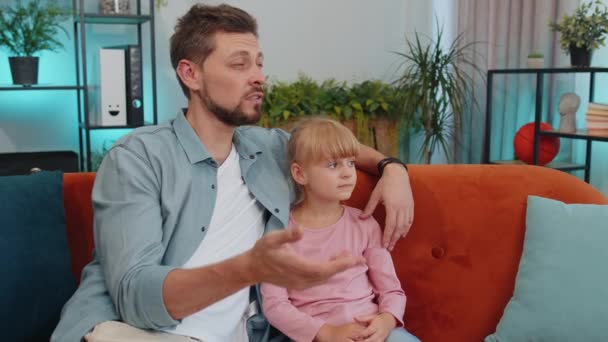 Young Loving Man Dad Talking Little Daughter Toddler Together Couch — Stockvideo