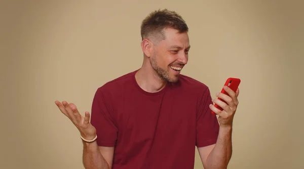 Happy Excited Joyful Young Man Use Smartphone Typing Browsing Say — Stock Fotó