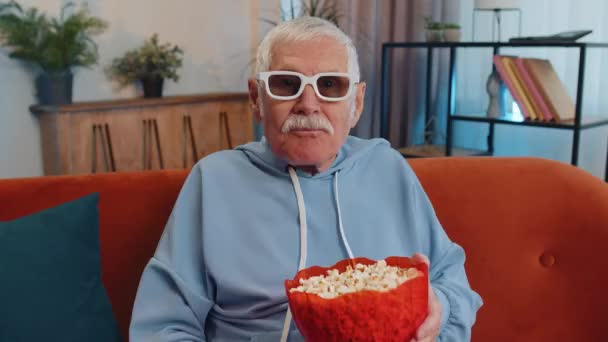 Excited Senior Old Grandfather Sitting Sofa Eating Popcorn Watching Interesting — Stock video