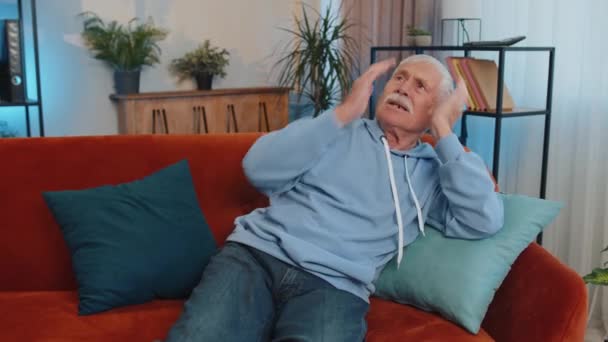 Repair Work Neighbours Irritated Senior Man Sit Couch Cover Ears — Vídeo de Stock