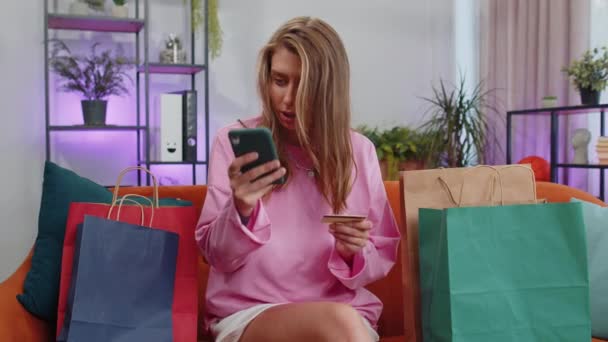 Happy Shopaholic Consumer Girl Sitting Shopping Bags Modern Home Apartment — Stockvideo