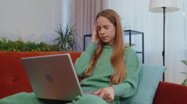 Tired student girl child kid freelancer use laptop, suffering from headache problem tension and migraine, stress. Young woman works on notebook, sends messages, makes online purchases, watching movies