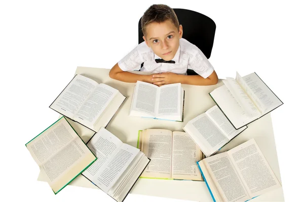Мальчик и книги — стоковое фото