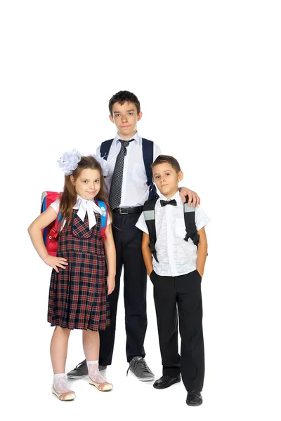 Niños en edad escolar con bolsas escolares — Foto de Stock