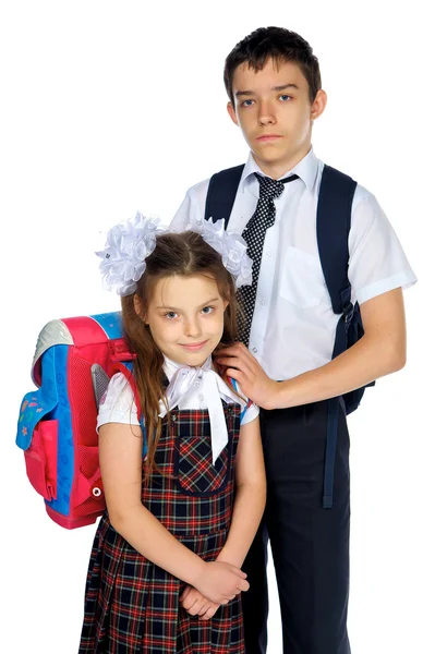 Schoolboy and schoolgirl with school bags — Stock Photo, Image