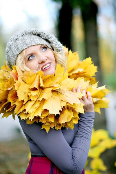 Woman with yellow leaves Royalty Free Stock Photos