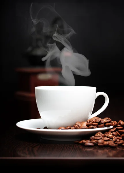 Coffee cup with smoke and grain