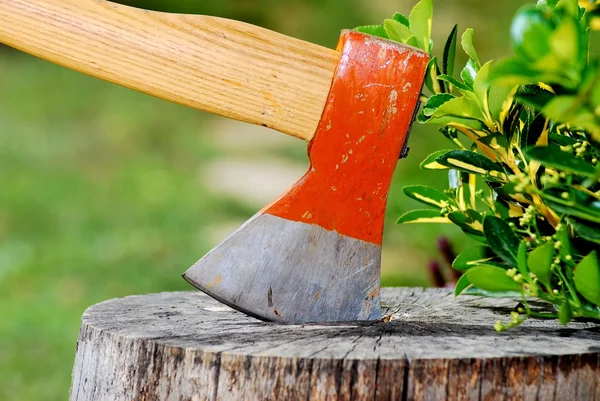 Axe in a wooden log — Stock Photo, Image