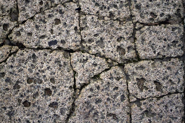 Fläckig sprucken sten bakgrund — Stockfoto