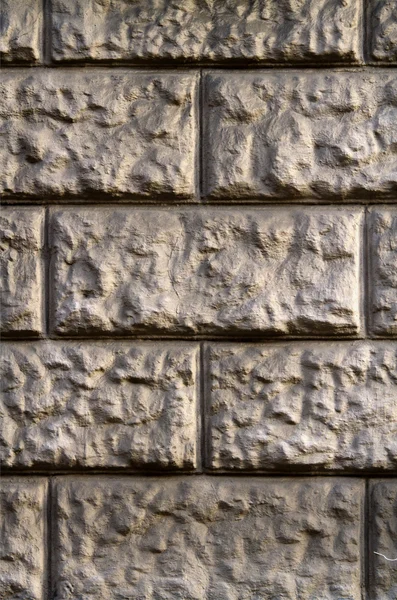 Wall of gray-yellow stone — Stock Photo, Image