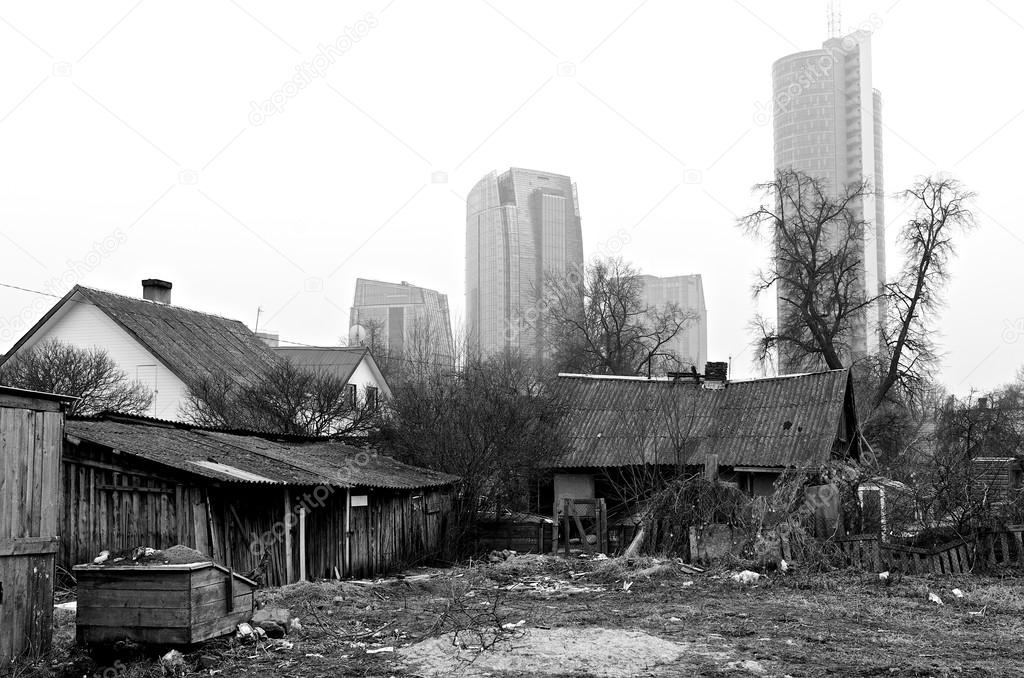 Vilnius, Lithuania. Vilnius on day time in black and white photo, urban and desolate district. Contrast city Vilnius. B&W photo. Lithuania. Abandoned city place and modern buildings in background