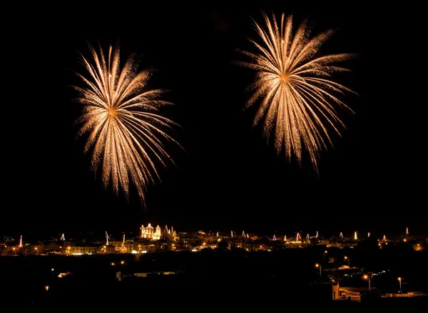 Fireworks,colorful fireworks background,fireworks explosion in dark sky with village silhouette in Malta, fireworks in Malta, long exposure fireworks,Independence day, fireworks festival with reflect — Stock Photo, Image