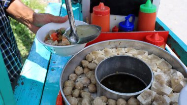  Variation of Meatball or bakso in boiling pan with soup in the center