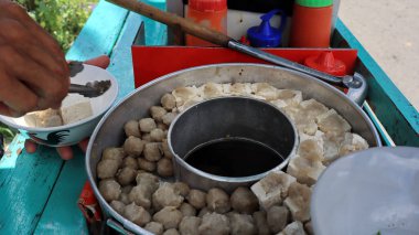 Variation of Meatball or bakso in boiling pan with soup in the center