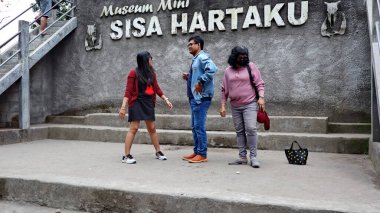 Tourists are looking at Museum Mini Sisa Hartaku (My Remaining Treasure Mini Museum), Yogyakarta, Indonesia July 20, 2022