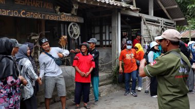 Tourists are looking at Museum Mini Sisa Hartaku (My Remaining Treasure Mini Museum), Yogyakarta, Indonesia July 20, 2022