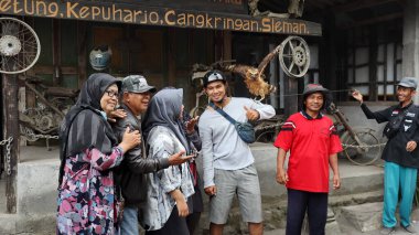 Tourists are looking at Museum Mini Sisa Hartaku (My Remaining Treasure Mini Museum), Yogyakarta, Indonesia July 20, 2022