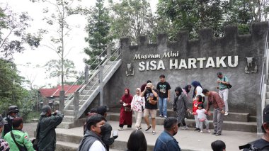 Tourists are looking at Museum Mini Sisa Hartaku (My Remaining Treasure Mini Museum), Yogyakarta, Indonesia July 20, 2022