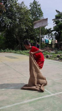 balap karung or sack race, traditional indonesian games to celebrate indonesia independence day, Batang Indonesia, August 17, 2022