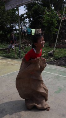balap karung or sack race, traditional indonesian games to celebrate indonesia independence day, Batang Indonesia, August 17, 2022