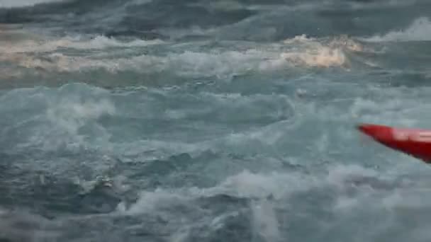 Shot of kayaker in wild waters struggling — Stock Video