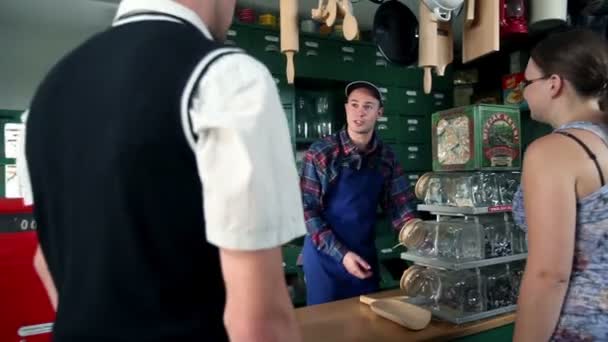 Shot of customers who are buying different things in an old, retro shop — Stock Video