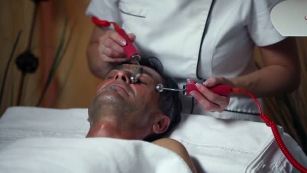 Shot of a special facial care for a middle aged man — Stock Video