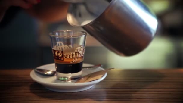 Still shot of pouring cup of coffee — Stockvideo