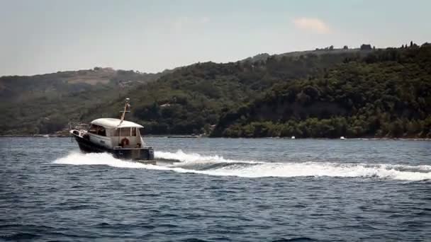 Shot of an old wooden boat passing by — Stock Video