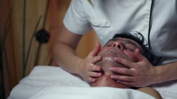 Shot of a special facial care for a middle aged man — Stock Video