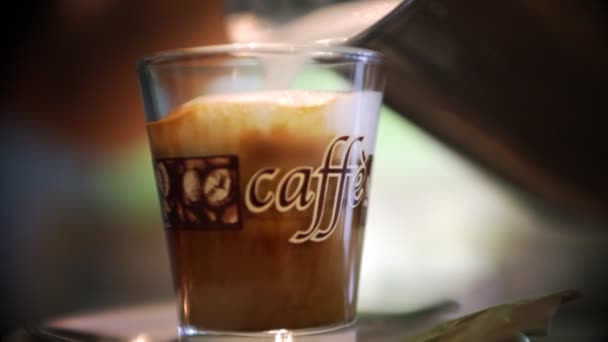 Still shot of waiter pouring cup of coffee for guests — Stock Video