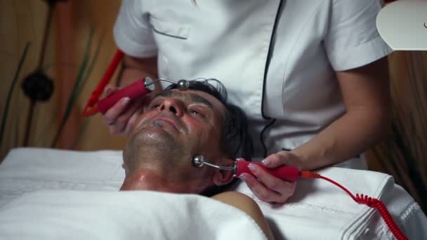 Shot of a special facial care for a middle aged man — Stock Video