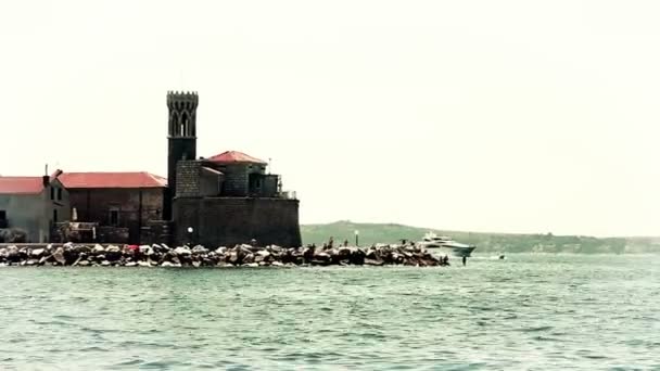 Shot of the boat moored at the shore. Shot is taken from the moving boat — Stock Video