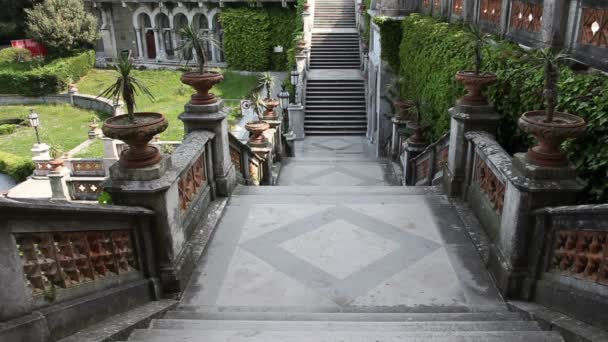 Shot of an old staircase that leads to the garden in front of the castle — Stock Video