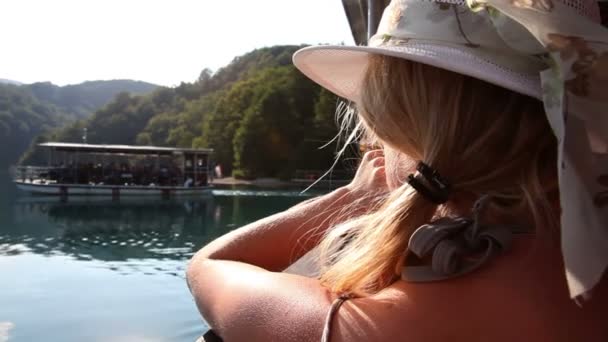 Young woman observing the landscape from the boat — Stockvideo