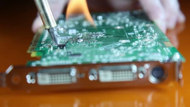 Shot of a man repairing a graphics card — Stock Video