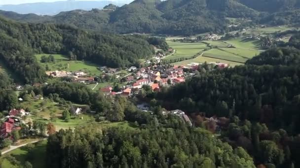 Panorama slide shot from helicopter representing valley with small towns with lots of houses and other infrastructures — Stock Video