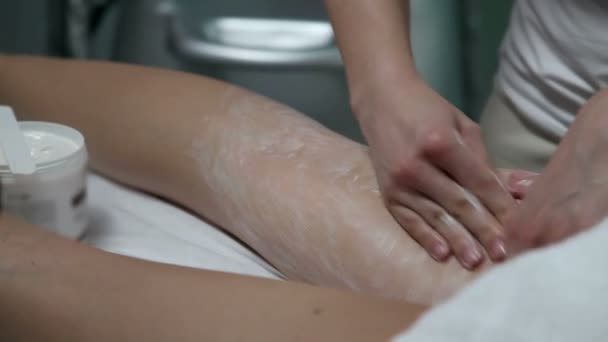 Professional massaging legs with a special cream — Stock Video