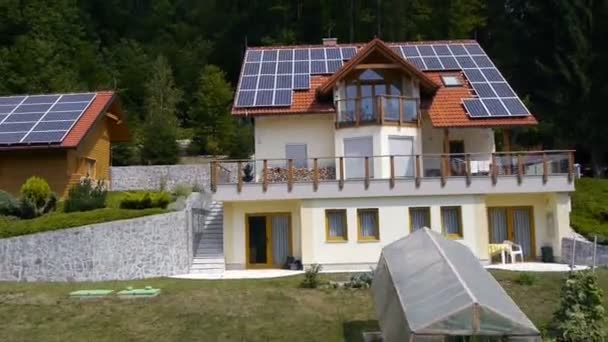 Panorama slide shot from helicopter representing an industrial part of a small town with roofs covered with solar power stations — Stock Video