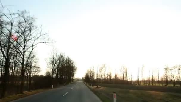 Car driving on the road at sunset — Stock Video